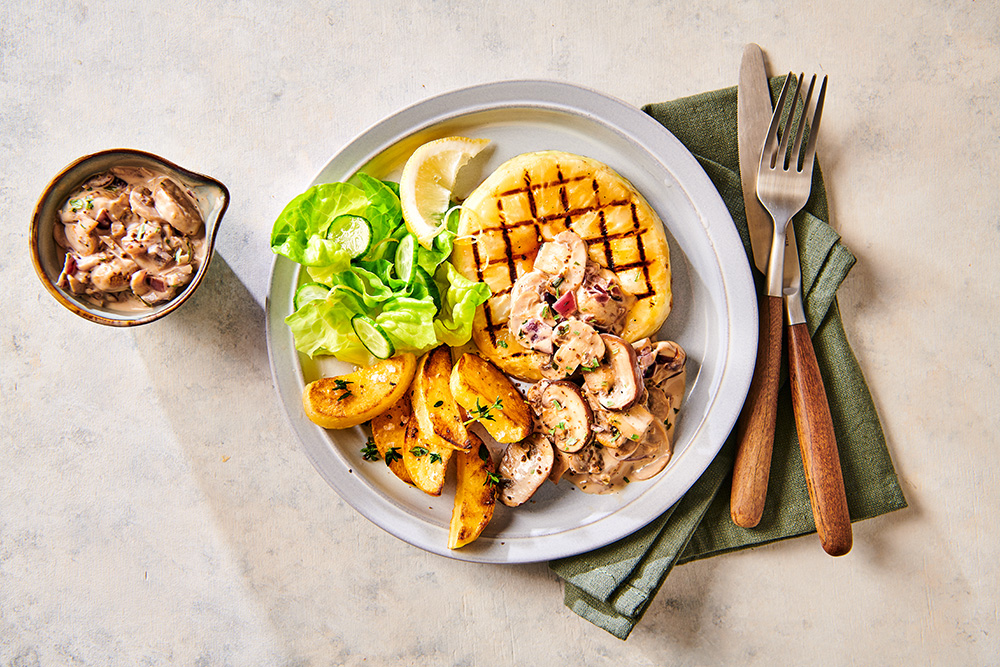 Knolselderijsteaks met champignonroomsaus